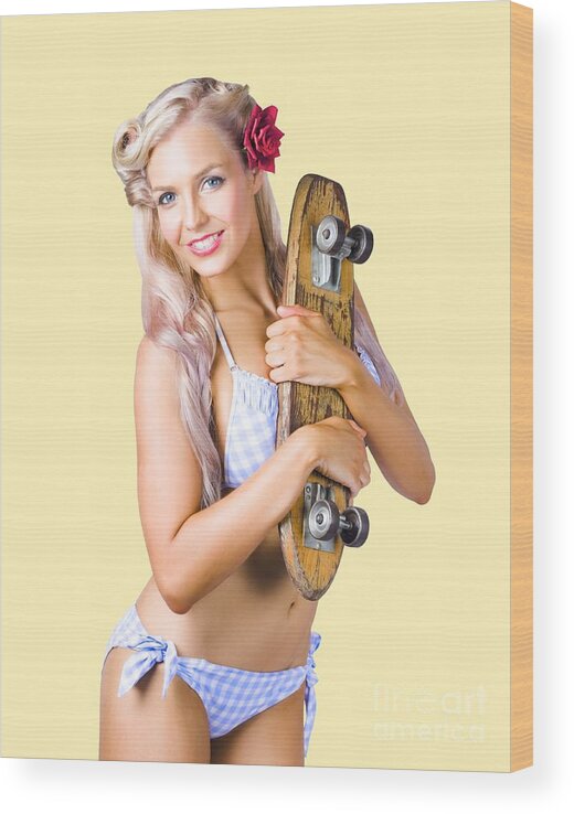 Skate Wood Print featuring the photograph Pinup woman in bikini holding skateboard by Jorgo Photography