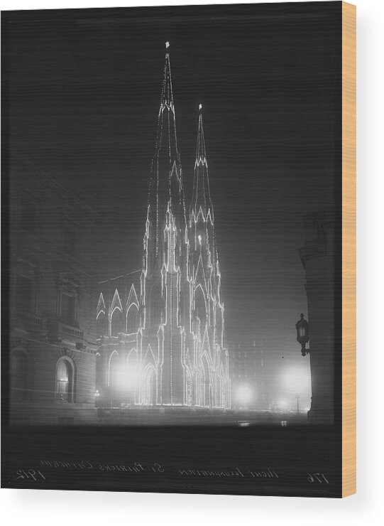 St. Patrick's Cathedral Wood Print featuring the photograph St. Patricks Cathedral Illuminated At by The New York Historical Society