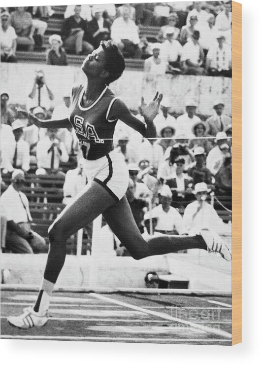 People Wood Print featuring the photograph Wilma Rudolph Crossing The Finish Line by Bettmann
