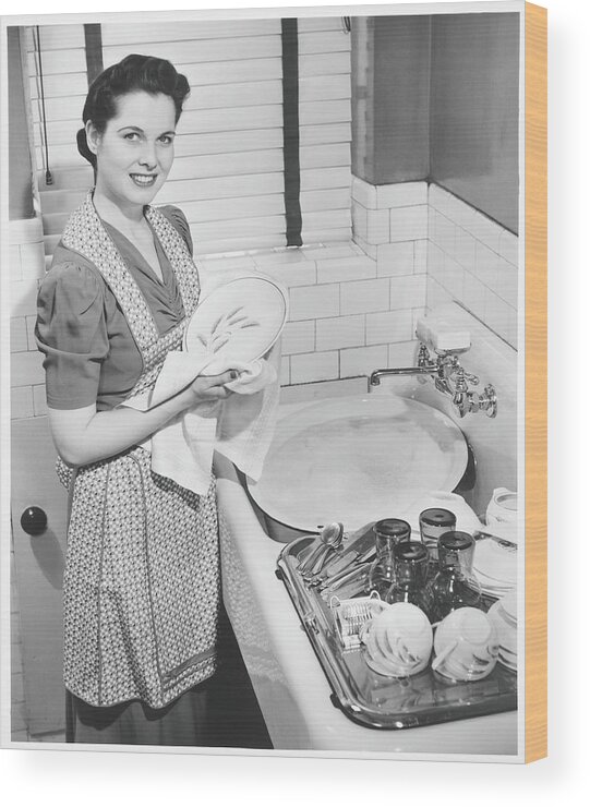 Three Quarter Length Wood Print featuring the photograph Woman Drying Dishes At Kitchen Sink by George Marks