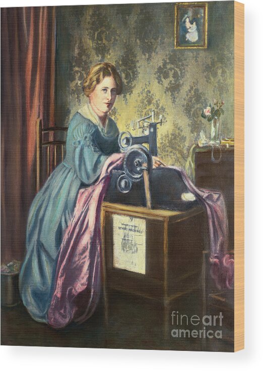 Working Wood Print featuring the photograph Young Woman Using Early Sewing Machine by Bettmann
