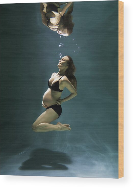 Underwater Wood Print featuring the photograph Pregnant woman underwater #1 by Henrik Sorensen