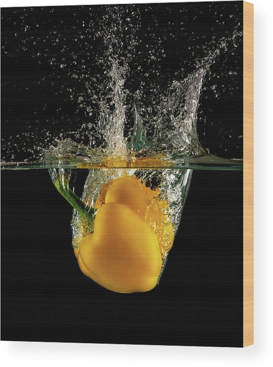 Pepper Wood Print featuring the photograph Yellow bell pepper dropped and slashing on water #2 by Michalakis Ppalis