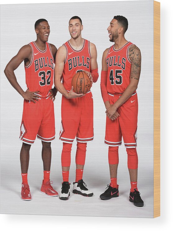 Kris Dunn Wood Print featuring the photograph Zach Lavine, Kris Dunn, and Denzel Valentine by Randy Belice