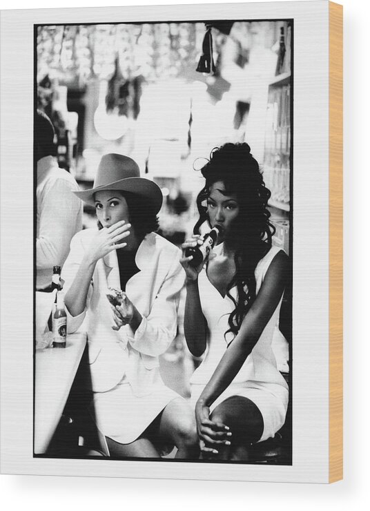 Accessories Wood Print featuring the photograph Christy Turlington and Naomi Campbell at the Central Grocery, New Orleans by Arthur Elgort