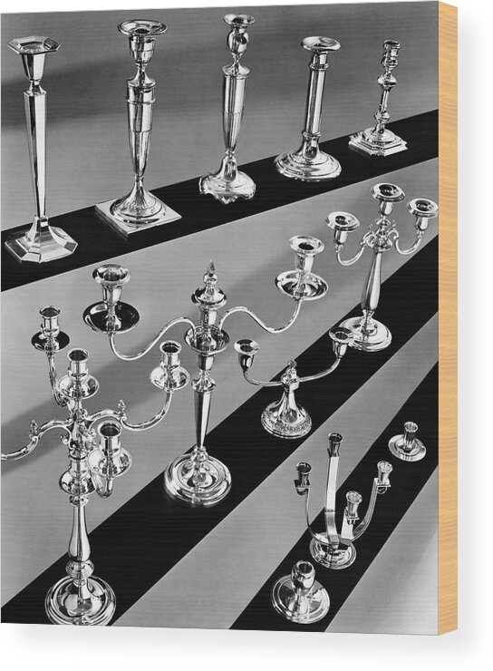 Still Life Wood Print featuring the photograph Rows of Silver Candlesticks and Candelabras by Peter Nyholm