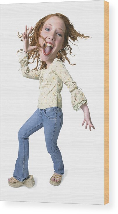 White Background Wood Print featuring the photograph Photo Caricature Of A Caucasian Redheaded Teenage Girl As She Playfully Dances by Photodisc