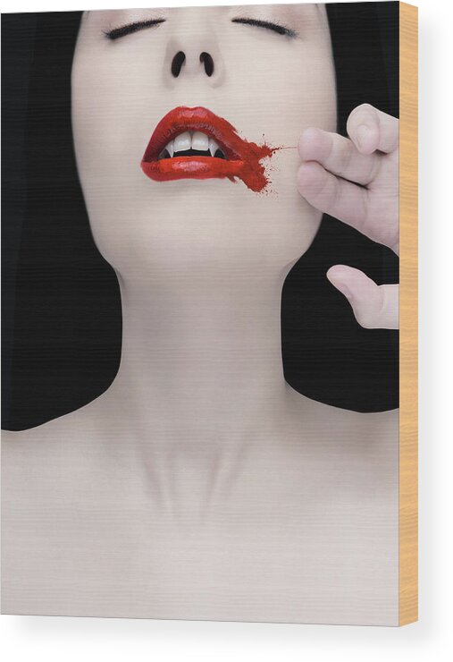 People Wood Print featuring the photograph A Vampire Wiping Blood From Her Mouth by Colin Anderson