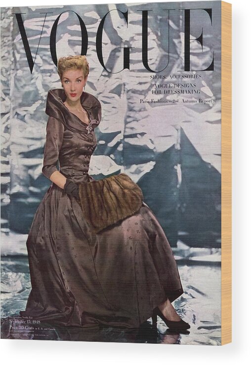 Fashion Wood Print featuring the photograph A Vogue Cover Of A Woman Wearing A Brown Dress by Erwin Blumenfeld