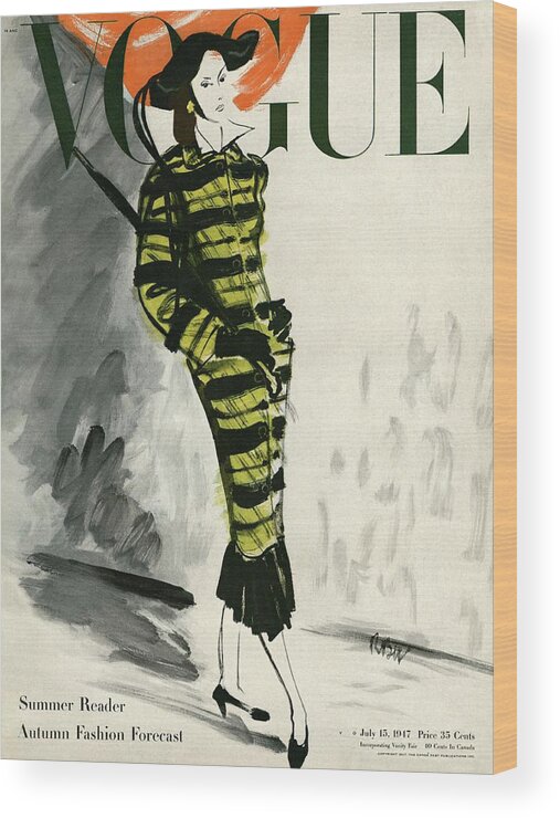 Exterior Wood Print featuring the photograph A Vogue Cover Of A Woman Wearing A Striped Coat by Rene Bouet-Willaumez
