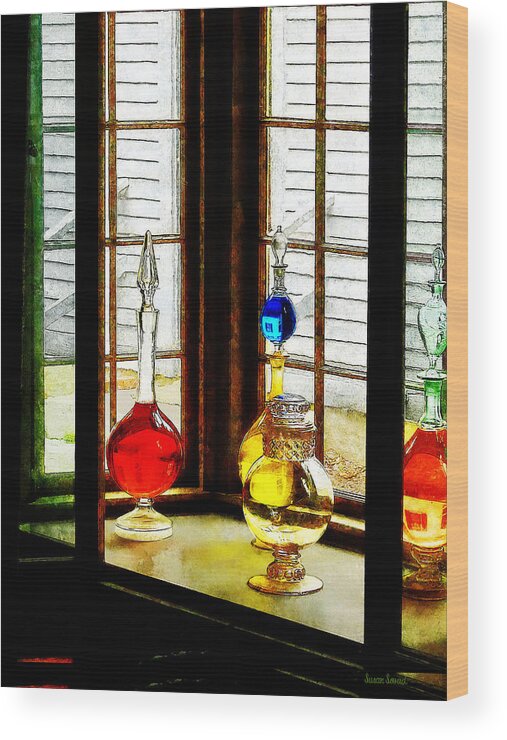 Pharmacies Wood Print featuring the photograph Pharmacist - Colorful Bottles in Drug Store Window by Susan Savad