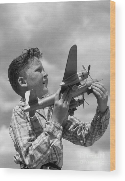 1950s Wood Print featuring the photograph Boy With Model Airplane, C. 1940s by H. Armstrong Roberts/ClassicStock