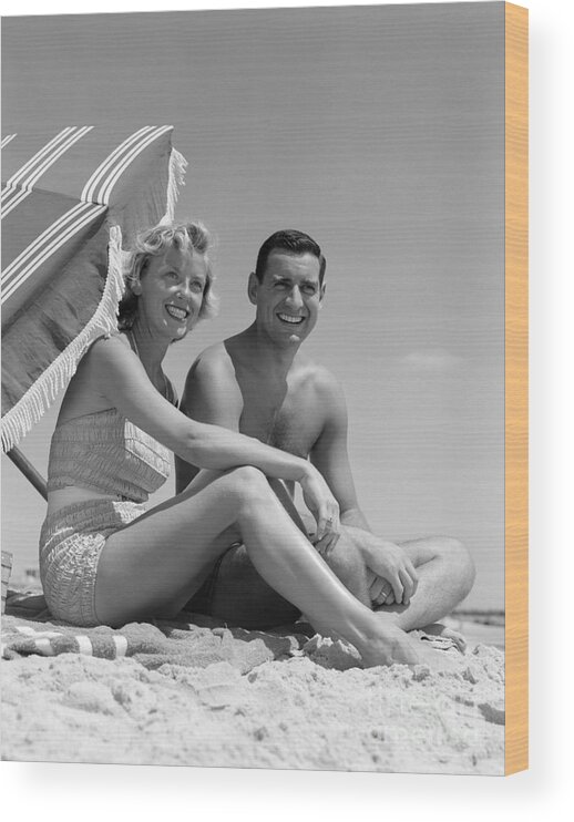 1950s Wood Print featuring the photograph Couple At The Beach, C.1950s by H. Armstrong Roberts/ClassicStock