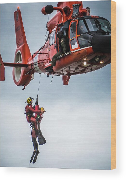 1 Pid Color Open Wood Print featuring the photograph Rescuer and Victim in Hoist by Gregory Daley MPSA