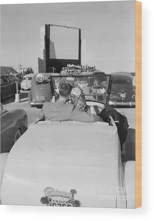 Austin Wood Print featuring the photograph Couple Seated In Car At Drive-in by Bettmann