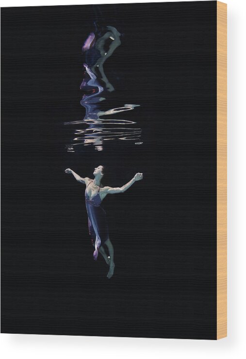 Ballet Dancer Wood Print featuring the photograph Female Dancer Underwater Against Black by Thomas Barwick