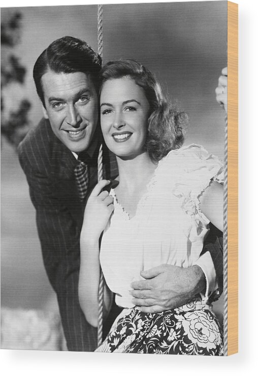 Donna Reed Wood Print featuring the photograph JAMES STEWART and DONNA REED in IT'S A WONDERFUL LIFE -1946-. by Album
