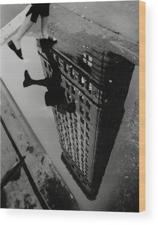 Reflection Of Flat Iron Building In Puddle Wood Print featuring the photograph Street Reflections by Chris Bliss