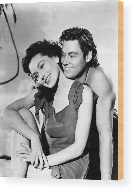 Johnny Weissmuller Wood Print featuring the photograph MAUREEN O'SULLIVAN and JOHNNY WEISSMULLER in TARZAN'S SECRET TREASURE -1941-. by Album