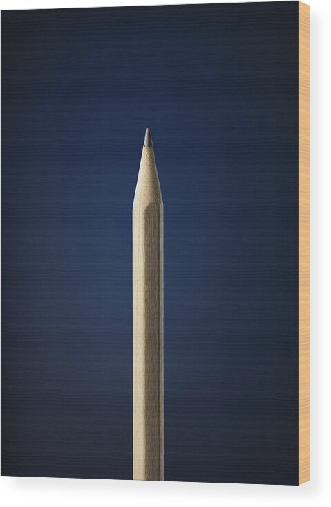 Vertical Wood Print featuring the photograph Pencil Against A Blue Background by Stuart Minzey