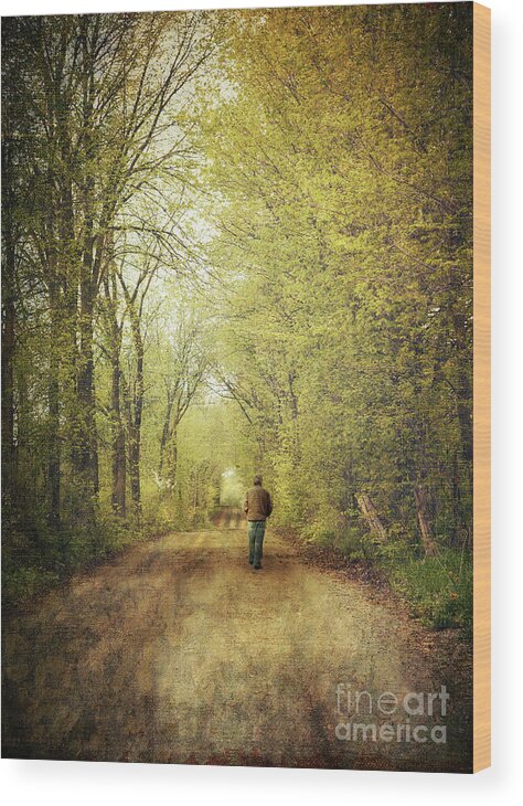 Afternoon Wood Print featuring the photograph Man walking on a lonely country road #1 by Sandra Cunningham