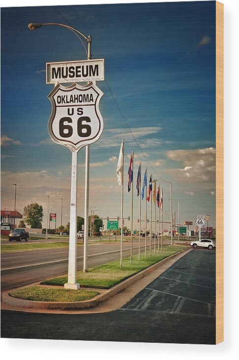 Route 66 Wood Print featuring the photograph Sign and Flags at Oklahoma Route 66 Museum by Buck Buchanan