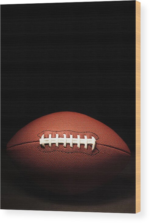 American Football Wood Print featuring the photograph American Football On Black #1 by Pgiam