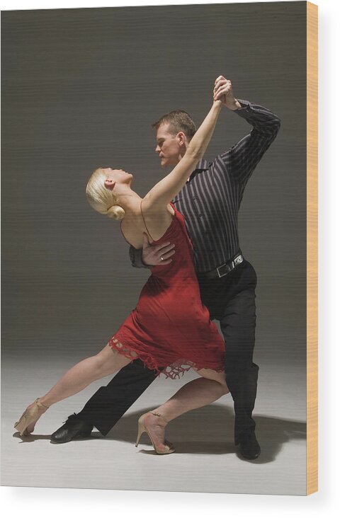Coordination Wood Print featuring the photograph Man And Woman Dancing Tango #1 by Pm Images