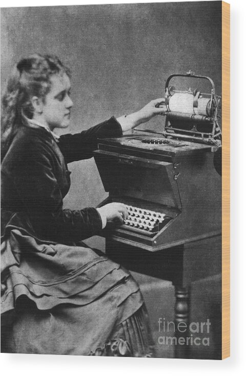 Child Wood Print featuring the photograph A Young Woman With An Early Typewriter by Bettmann