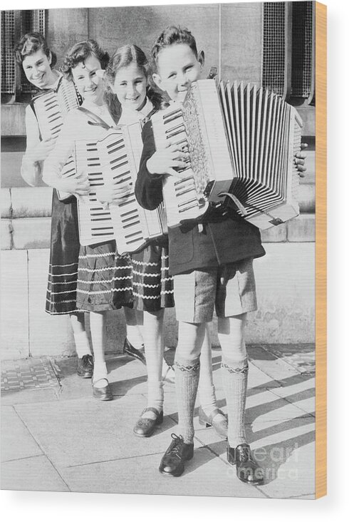 Child Wood Print featuring the photograph Children Playing Accordions by Bettmann