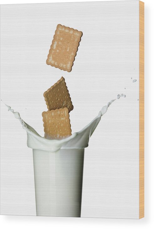 Milk Wood Print featuring the photograph Cookies Splashing Into Glass Of Milk by Walter Zerla