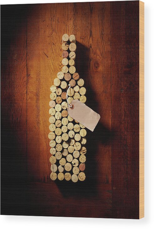 Alcohol Wood Print featuring the photograph Wine Bottle In Corks by Wragg