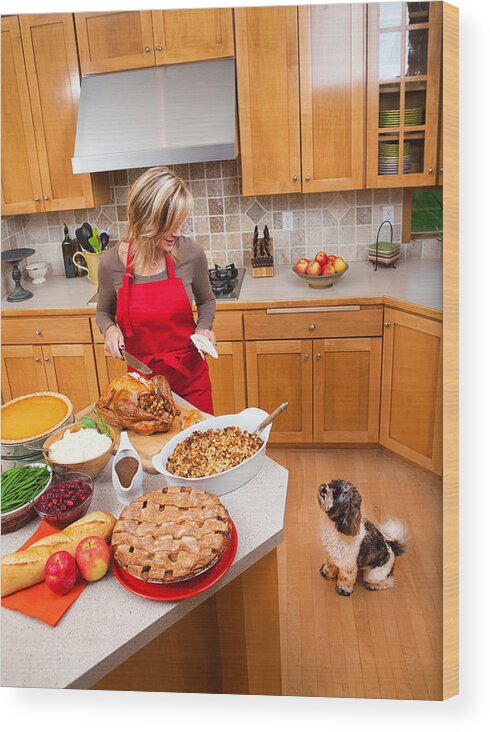 Pets Wood Print featuring the photograph Woman Carving Roast Turkey Preparing Thanksgiving and Christmas Dinner by YinYang