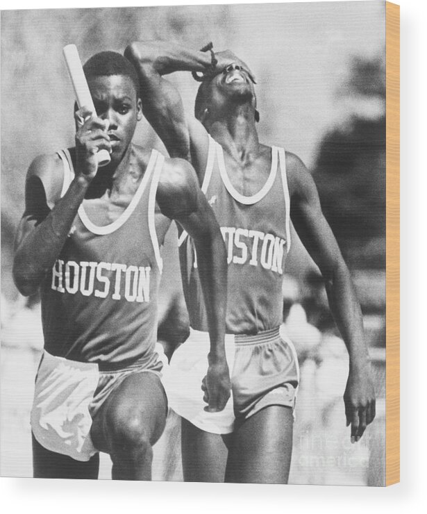 Young Men Wood Print featuring the photograph Carl Lewis Running Relay With Greg by Bettmann