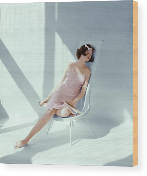 #new2022vogue Wood Print featuring the photograph Dorothea Mcgowan Sleeping In A Fiberglass Chair by Leombruno-Bodi