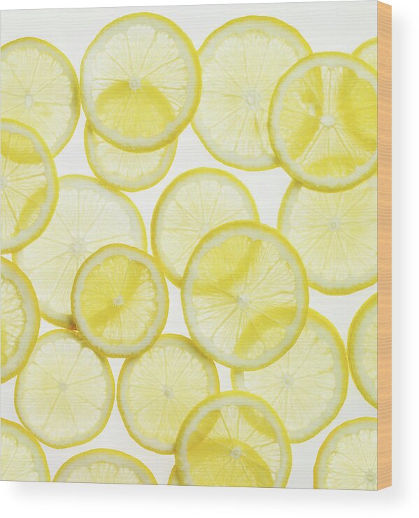 White Background Wood Print featuring the photograph Lemon Slices Arranged In Pattern by Lauren Burke