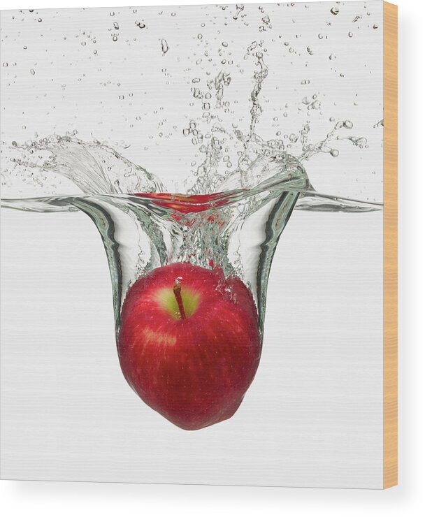 White Background Wood Print featuring the photograph Red Apple Splashing In Water by Don Farrall