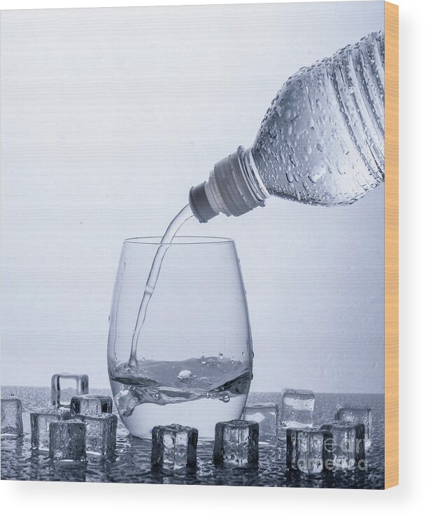 Water Wood Print featuring the photograph Pouring water in glass by Jelena Jovanovic