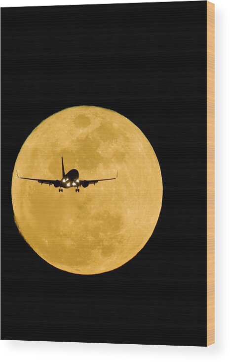 Moon Wood Print featuring the photograph Aeroplane Silhouetted Against A Full Moon by David Nunuk