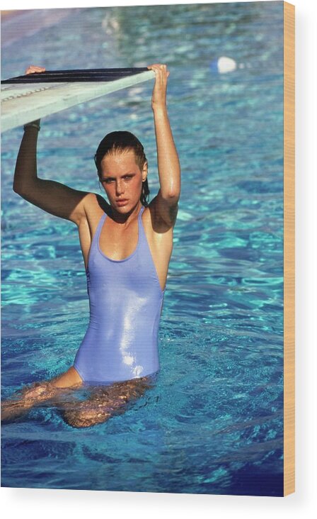 #condenastvoguephotograph Wood Print featuring the photograph Patti Hansen Wearing A Blue Swimsuit by Arthur Elgort