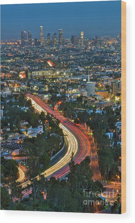 La Skyline Wood Print featuring the photograph LA Skyline Night Magic Hour dusk streaking tail lights Freeway by David Zanzinger