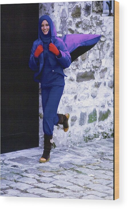 Accessories Wood Print featuring the photograph Model Wearing A Blue Raincoat by Arthur Elgort