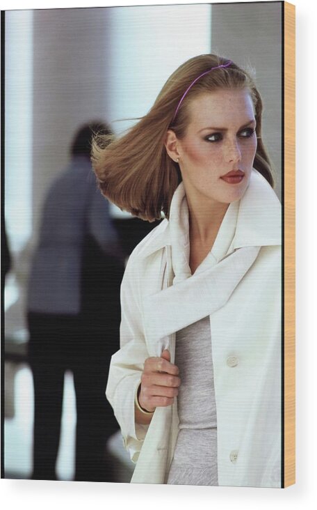 Fashion Wood Print featuring the photograph Patti Hansen Wearing A White Raincoat by Arthur Elgort