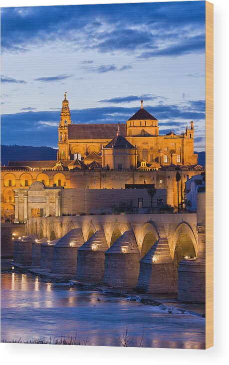 Cordoba Wood Print featuring the photograph Puente Romano and Mezquita at Twilight in Cordoba by Artur Bogacki