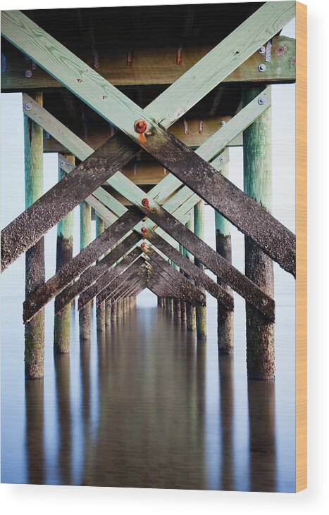 In A Row Wood Print featuring the photograph Underneath Pier by Enzo Figueres