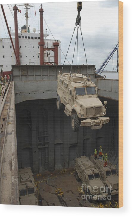 Mv Marilyn Wood Print featuring the photograph A Harbor Crane Lifts A Mine-resistant by Stocktrek Images