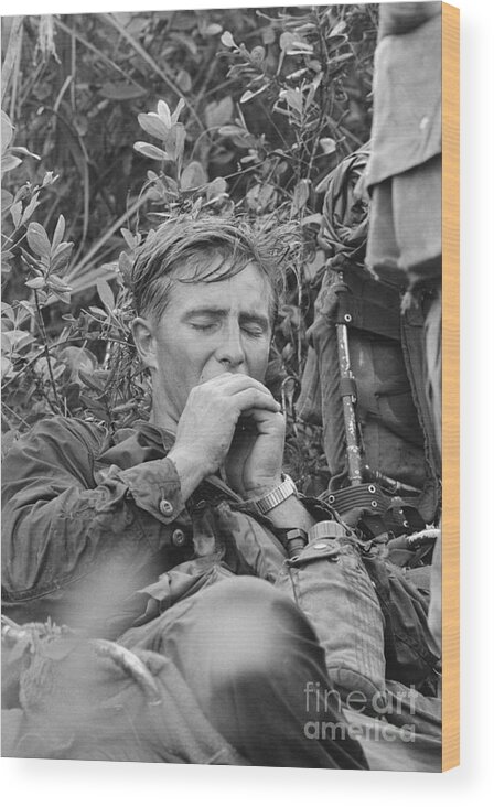 Vietnam War Wood Print featuring the photograph American Soldier In Vietnam Yawning by Bettmann