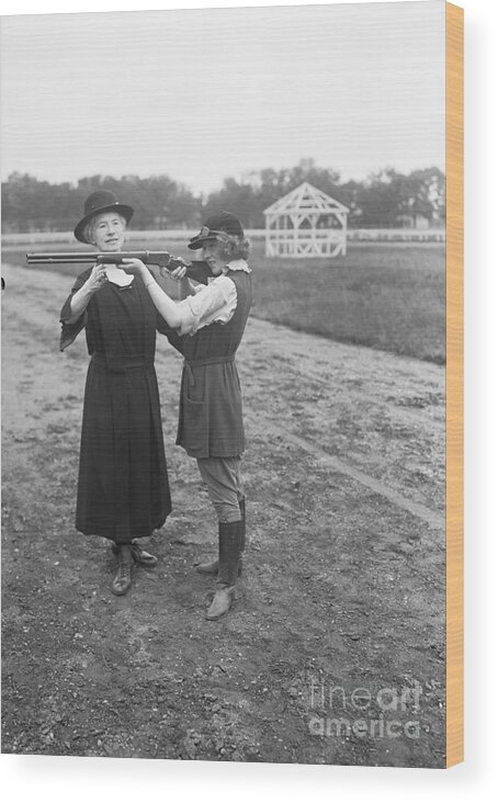 People Wood Print featuring the photograph Annie Oakley Instructing Dorothy Stone by Bettmann