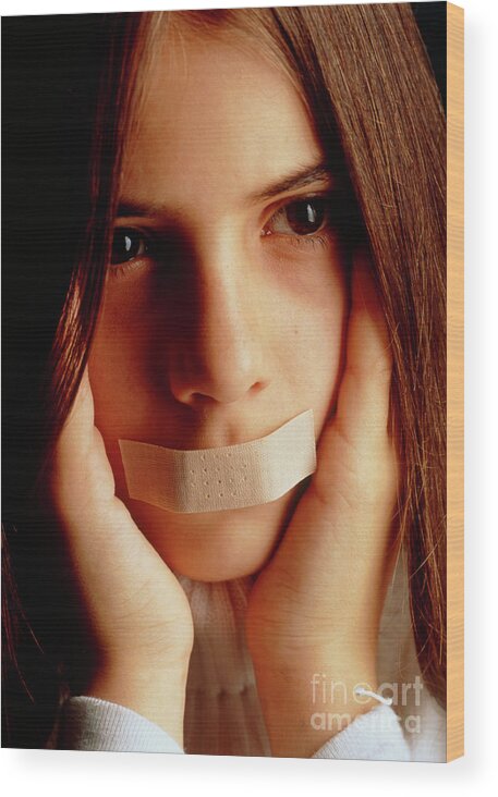 Autism Wood Print featuring the photograph Autism: Girl With Tape Over Mouth & Covering Ears by Oscar Burriel/science Photo Library