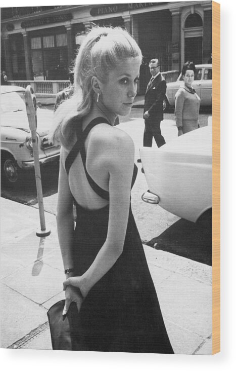 Looking Over Shoulder Wood Print featuring the photograph Deneuve At Premiere by Keystone